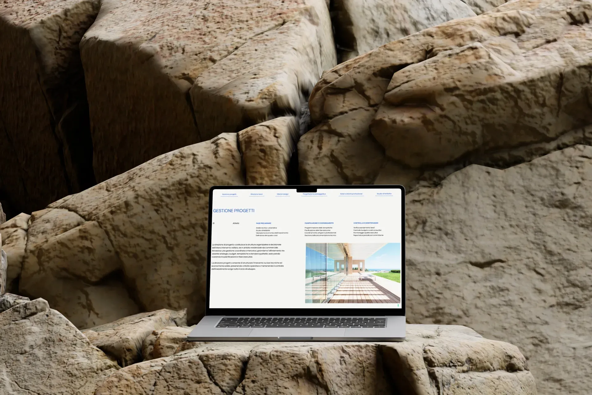 Dream Project Solution, laptop mockup on rock with project management page and editorial layout